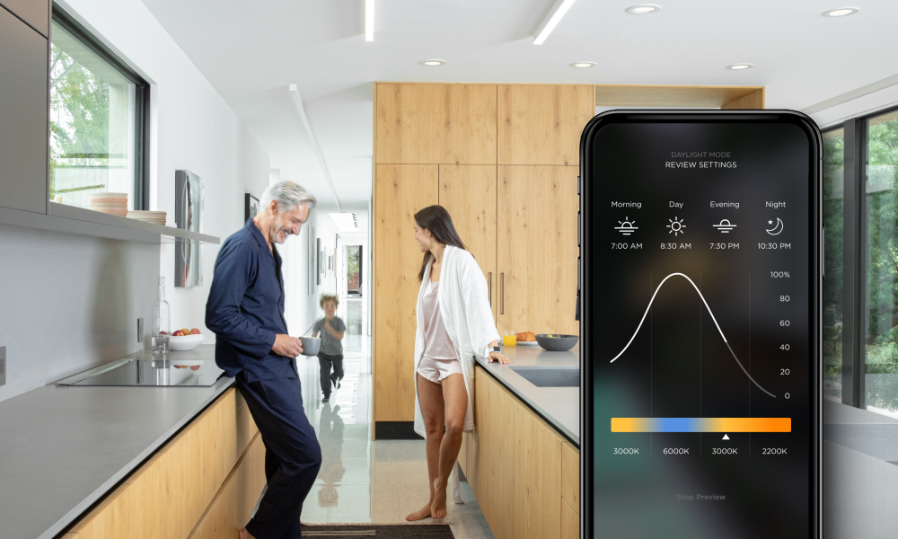 Picture of a family in the kitchen and a closeup of the Savant Power phone interface